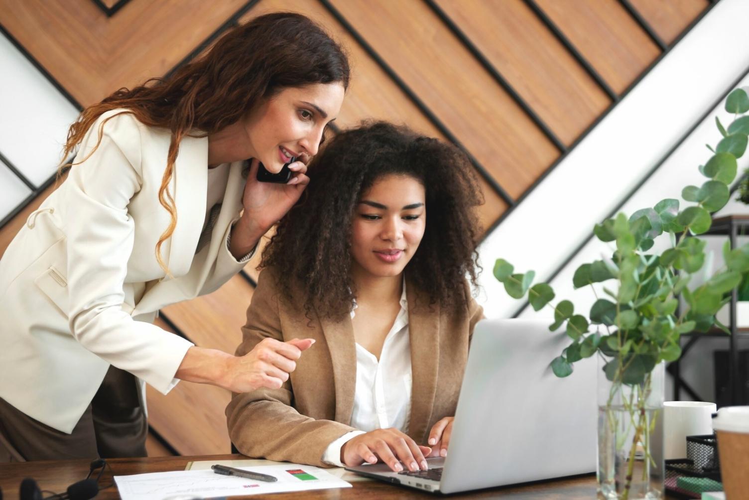 Corporate finance team analyzing investment metrics and performance data